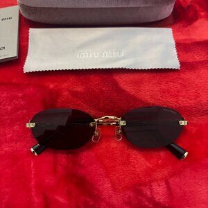 Miu Miu Black Oval Rimless Sunglasses with Gold Accents